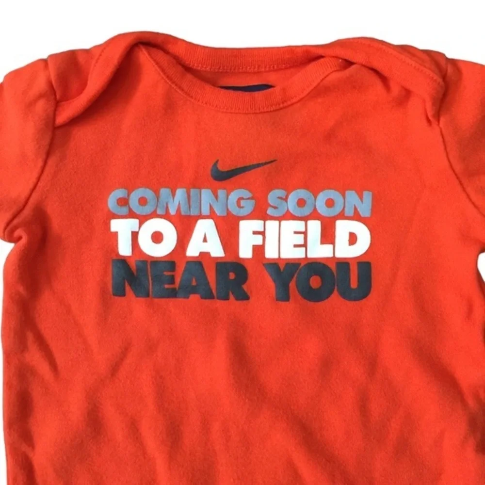 EUC Nike‎ orange onesie size 3-6M